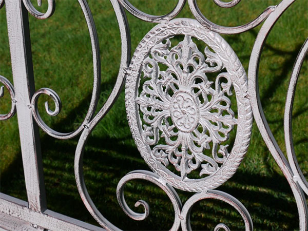 Antique Grey Metal Swirl Garden Bench - Close up image of the decorative pattern on the back of the garden bench