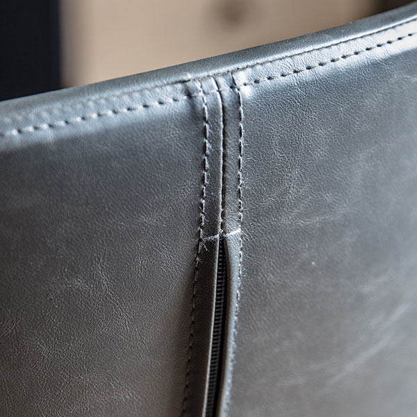 Harvest Direct Dimmock Charcoal Swivel Chair - Close up image of part of the back of the chair