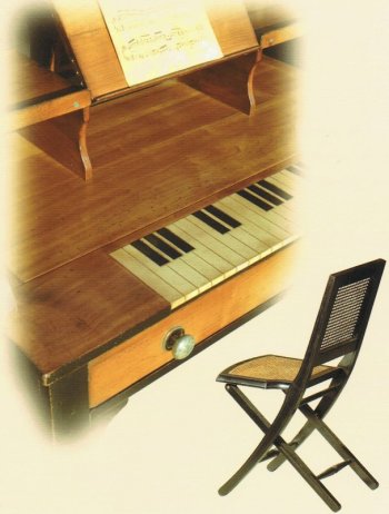 Close up image of the 19th C Felix Monge Chorister Table and Nomad Chair