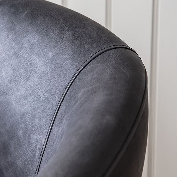 Harvest Direct Feynham Antique Ebony Leather Swivel Chair - Close up image of the stitching & leather finnish