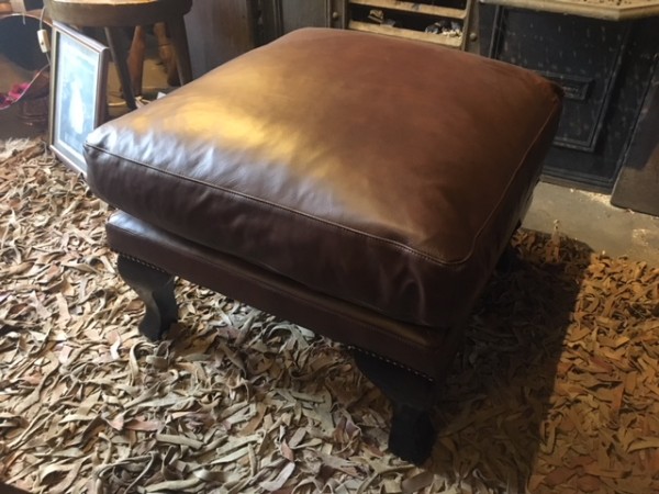 Tetrad Blake leather footstool on display in our furniture showrooms
