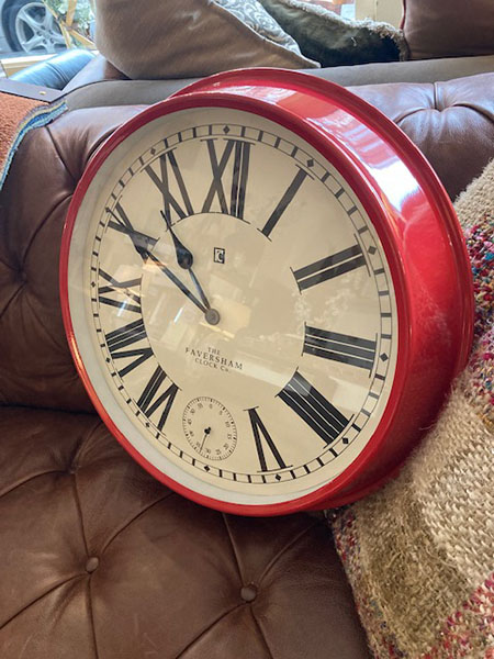 Gallery Direct Concord Red Wall Clock on display in our Southport showrooms showing the depth of the clock as well as the clock face